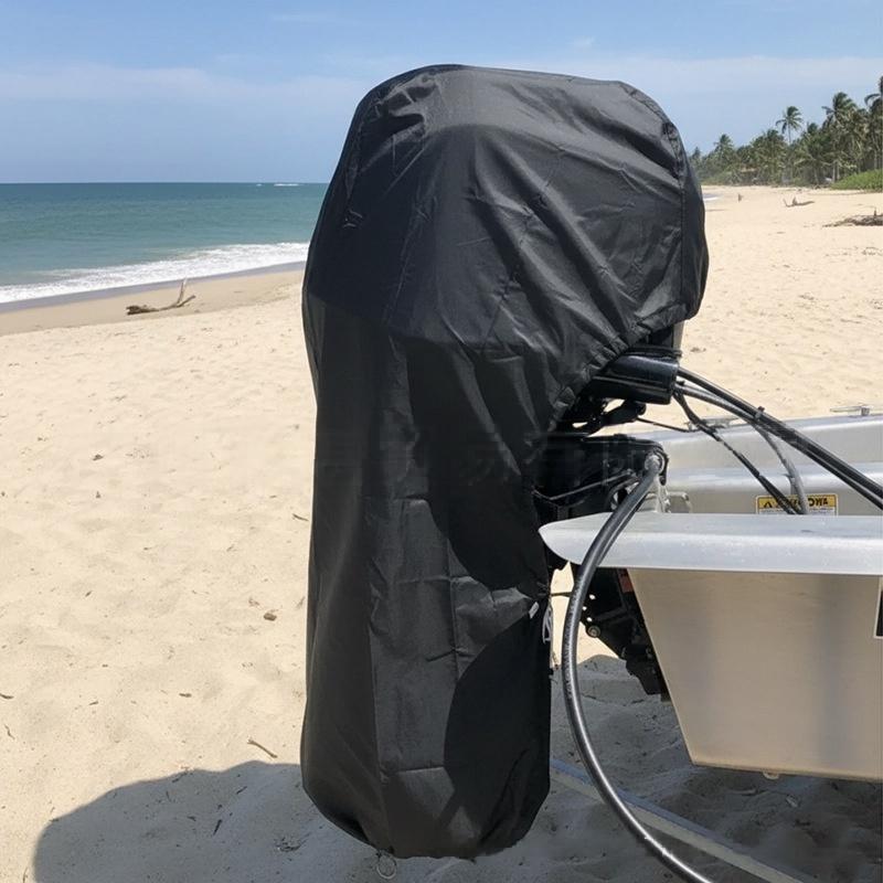Black outboard motor cover installed beside the coast